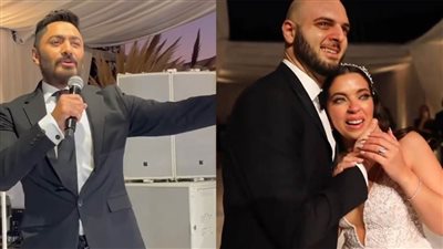بالفيديو..  تامر حسني يتسبب في بكاء عروسين في حفل زفافهما بعد مفاجأته المؤثرة لهما